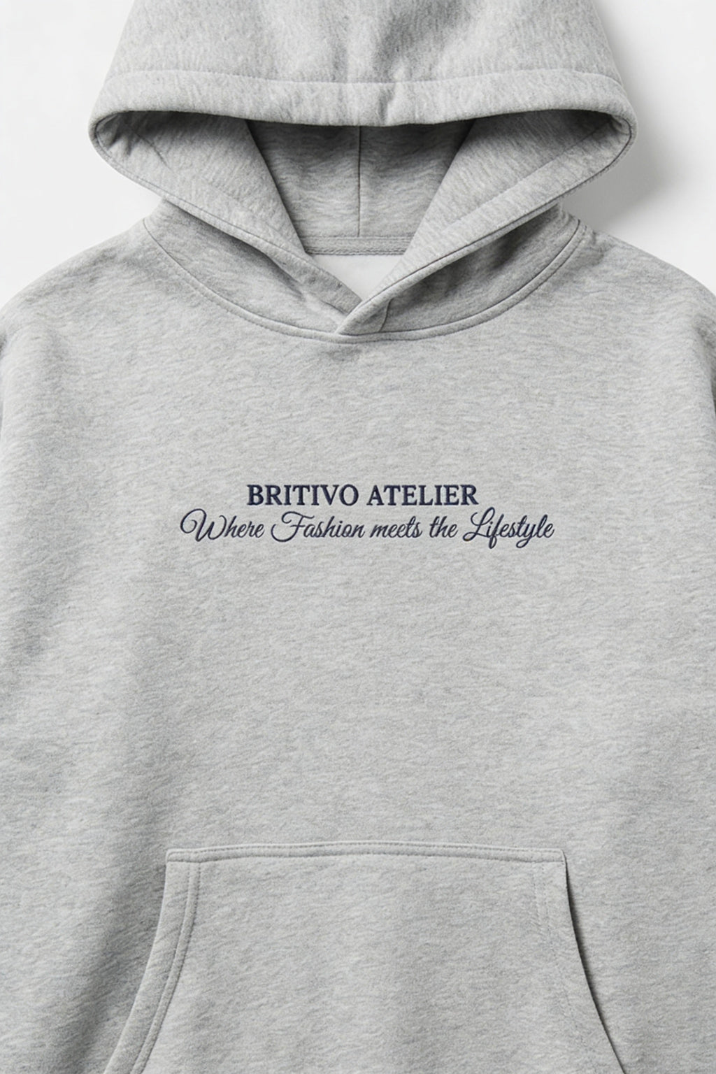Gray hoodie with 'BRITIVO ATELIER' text on a white background