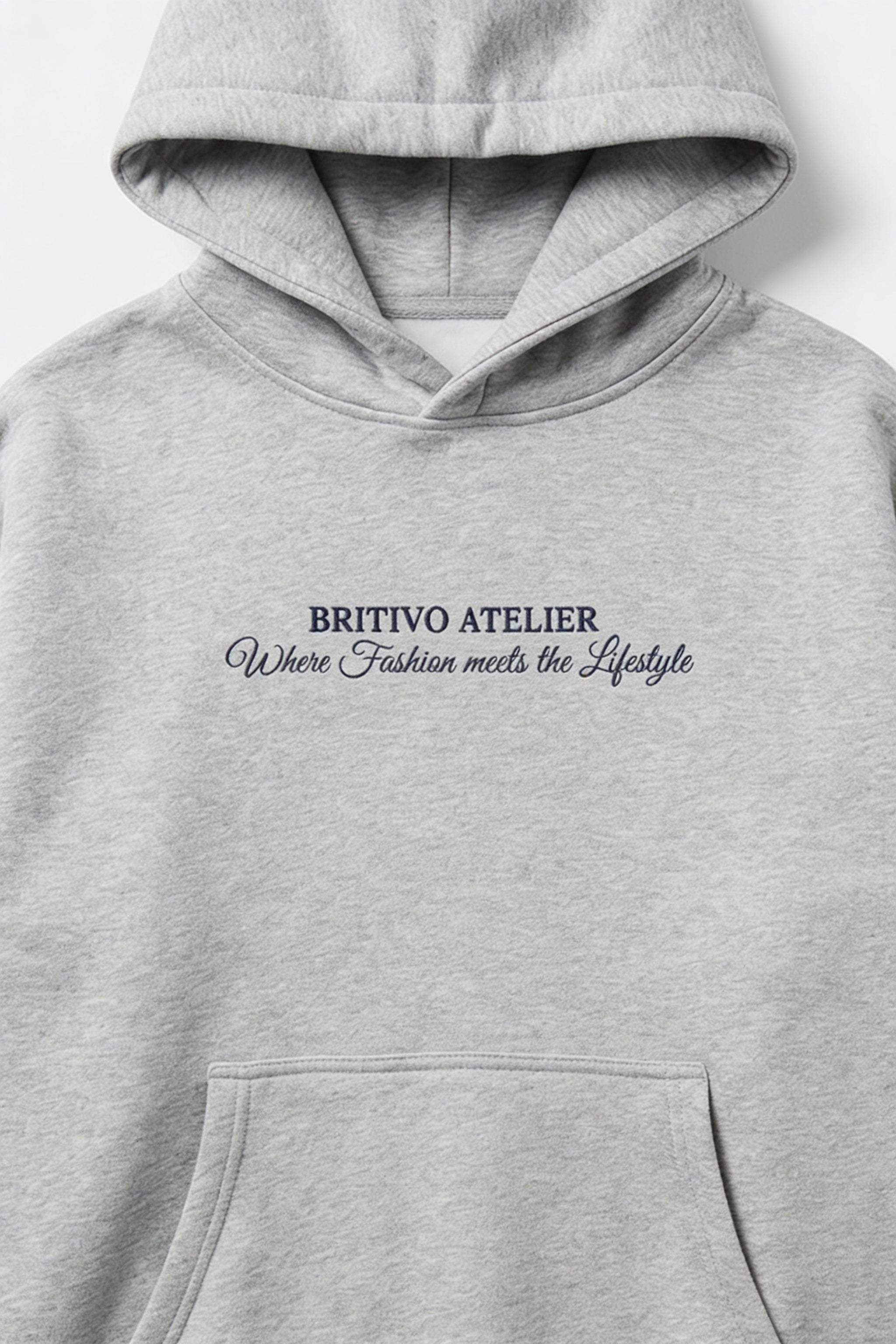 Gray hoodie with 'BRITIVO ATELIER' text on a white background